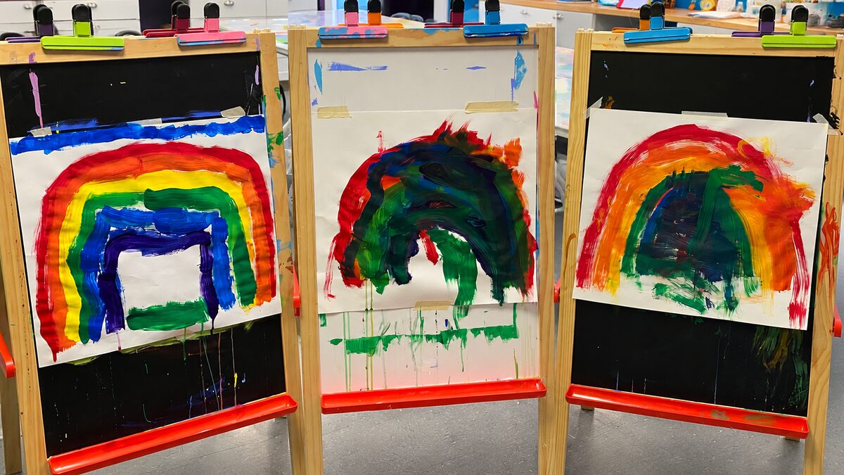 Tiny Hands rainbow paintings on easels